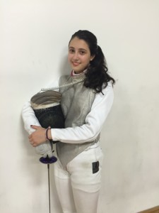 Zoe Barnette, ’19, poses with her fencing gear.