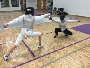 Zoe Barnette, ’19, competitively fences against her opponent. (photo courtesy of Zoe Barnette)