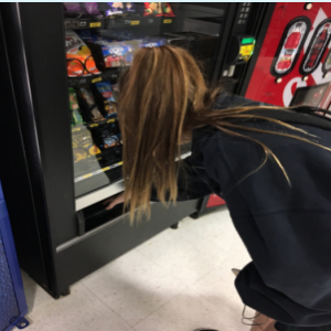 Maggie Quinn ‘17 grabs a snack from the current vending machine at the end of the school day. 