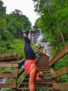 Photo courtesy of Ms. Beth Hagler. Ms. Beth Hagler doing a handstand at a top of a mountain